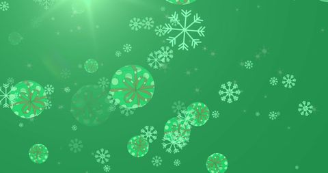 Floating Snowflakes and Baubles on Green Holiday Background - Download Free Stock Images Pikwizard.com