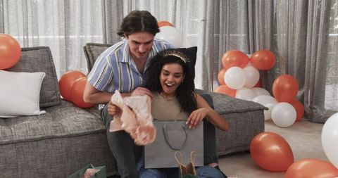 Couple Celebrating Birthday with Gifts at Home