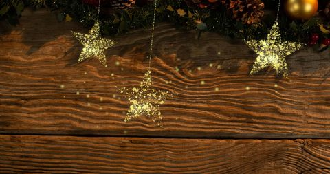 Golden Christmas Stars Shimmering Over Rustic Wooden Background - Download Free Stock Images Pikwizard.com