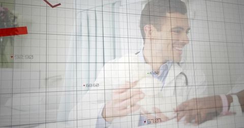 Smiling male doctor consulting child patient in modern clinic