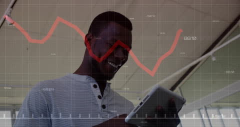 Businessman Using Tablet Analyzing Financial Data Graphics