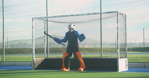 Field Hockey Goalkeeper Preparing in Stylish Sports Gear