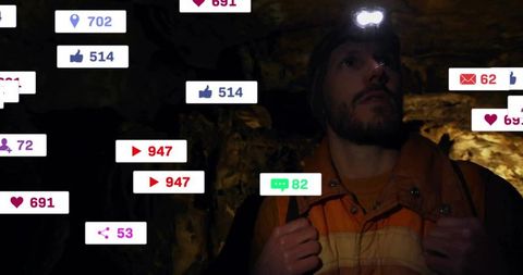 Man navigating cave with digital notifications floating around