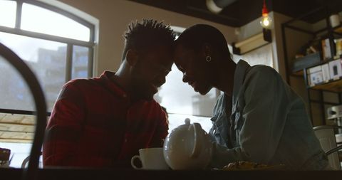 Romantic Couple Enjoying Coffee Date in Warm Café Ambience