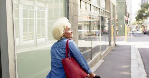 Stylish Woman With Red Bag Enjoying Urban City Walk - Download Free Stock Images Pikwizard.com