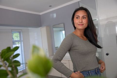 Serene Woman Standing in Modern Minimalist Bathroom