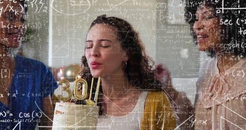 Woman blowing 30th birthday cake in mustard cardigan with friends, candles and math overlay