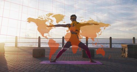 Sunset seaside yoga warrior pose with world map overlay for global wellness and travel