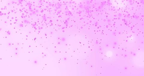 Vibrant pink bokeh lights on soft pink background