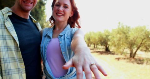 Caucasian Couple Celebrating Engagement in Sunny Outdoors - Download Free Stock Images Pikwizard.com