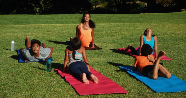Young children enjoy a lively outdoor yoga session, highlighting the joy of active health. - Download Free Stock Photos Pikwizard.com