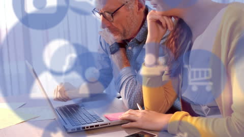 Digital Brainstorming: Business Team Planning with Icons Overlay