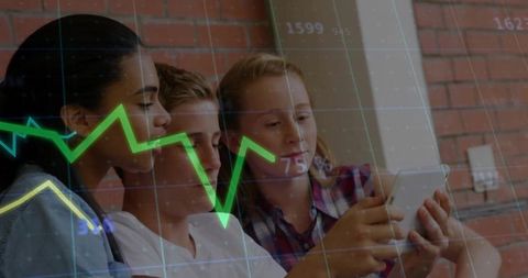 Three Friends Exploring Tablet with Digital Graph Overlay