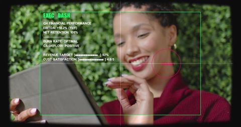 Smiling woman using tablet with exec_dash hud overlay and red target marker, green foliage