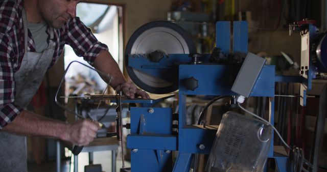 Craftsman using woodworking machine indoors - Download Free Stock Images Pikwizard.com