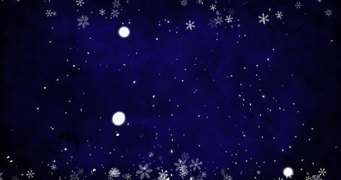 Snowflakes falling on deep blue winter background