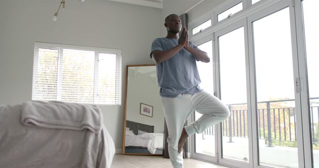 Young Man Practicing Yoga at Home in Bedroom - Download Free Stock Images Pikwizard.com