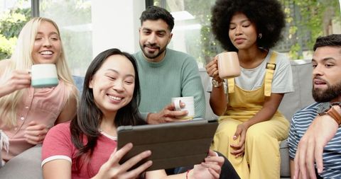 Diverse Friends Relaxing Together with Tablet and Coffee