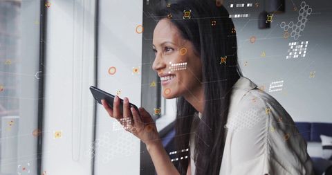 Caucasian Businesswoman Engaging with Smartphone and Digital Data