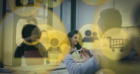 Diverse Team Collaborating with Digital Icons in Tech Environment