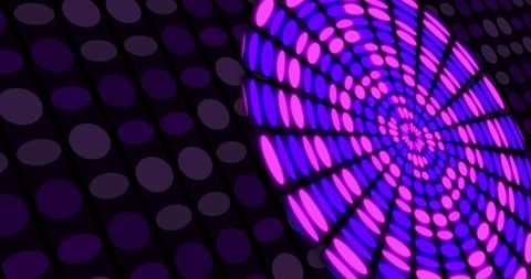 Colorful circular light display on black background with violet dots