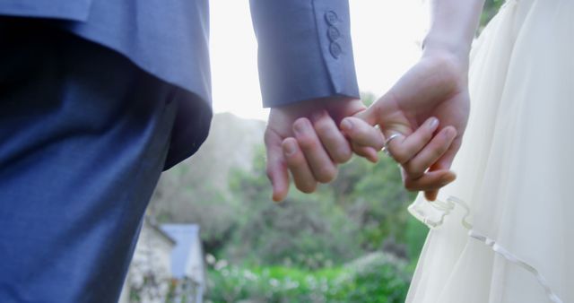 Newlyweds Holding Hands in Garden Sunset - Download Free Stock Images Pikwizard.com