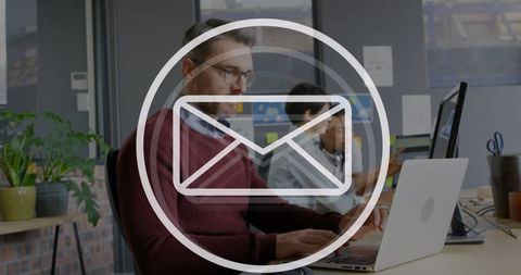 Professional man handling online communications in modern workspace