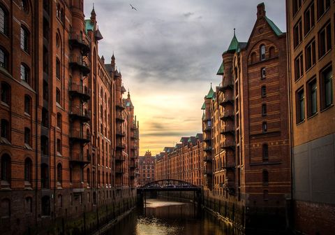Historic Brick Warehouses Along Canal at Sunset - Download Free Stock Images Pikwizard.com