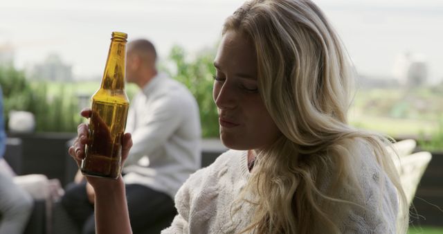 Young Woman Drinking Beer Outdoors - Download Free Stock Images Pikwizard.com