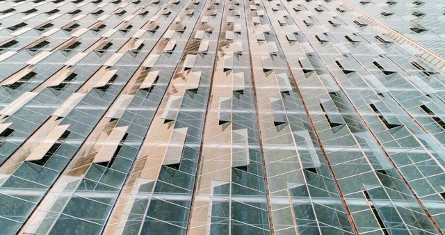The skyscraper's reflective glass facade mirrors the city, epitomizing modern architectural design. - Download Free Stock Photos Pikwizard.com