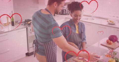 Couple Cooking Together in Home Kitchen Surrounded by Love
