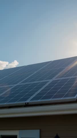Vertical solar roof video capturing sun flare over photovoltaic panels and mounting rails