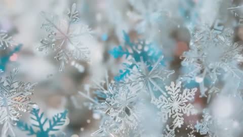 Winter Snowflakes Catching Light and Creating Twinkling Shimmers
