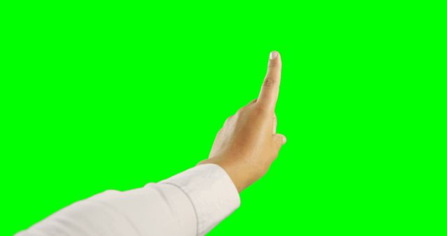 Hand pointing upward with index finger on green screen background. Ideal usage for adding visual cues in digital content, creating instructional materials, signifying concepts, serving as an overlay, or using in presentations and tutorials.