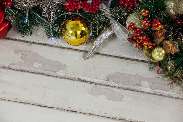 Fir with christmas decoration on a plank