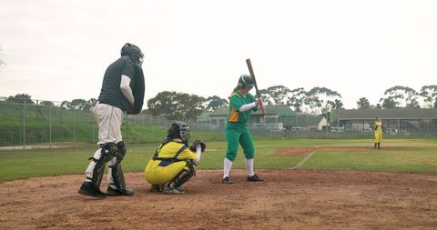 Baseball Players Preparing for pitch on Sunny Field