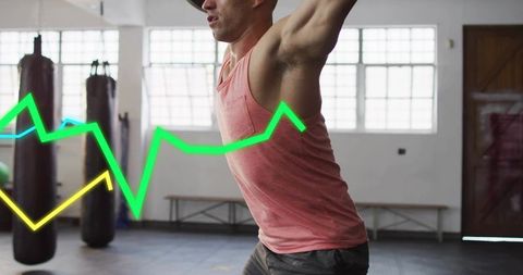 Male boxer training with neon performance overlays in gym, dynamic cardio and strength