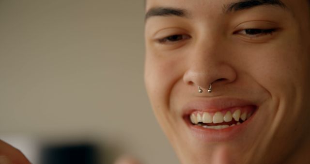 Smiling Young Adult with Nose Piercing - Download Free Stock Images Pikwizard.com