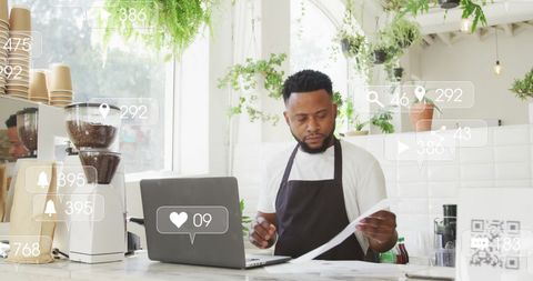 Barista Engaging with Social Media in Trendy Café Setting