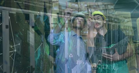 Warehouse Workers Analyzing Digital Interface and Logistics