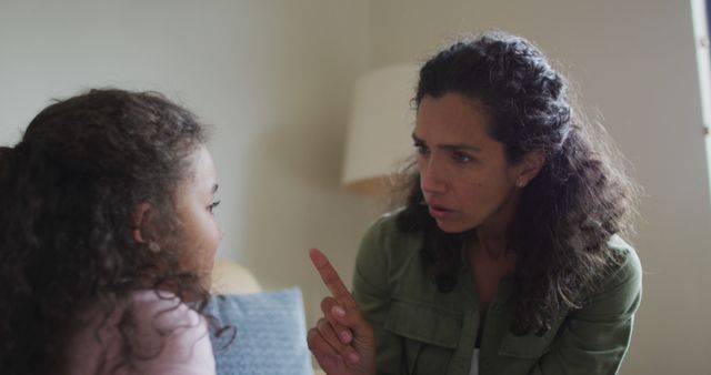 Woman Warning Little Girl During a Serious Conversation - Download Free Stock Images Pikwizard.com