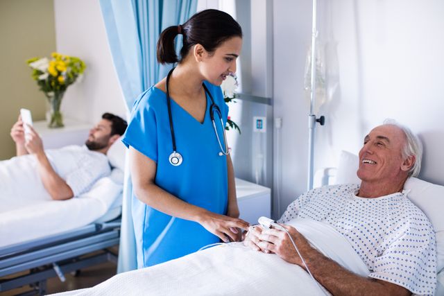 Nurse attending to elderly male patient in hospital ward. Ideal for use in healthcare, medical care, patient care, hospital, and elderly care contexts. Can be used in articles, brochures, and websites related to healthcare services, hospital facilities, and medical staff.