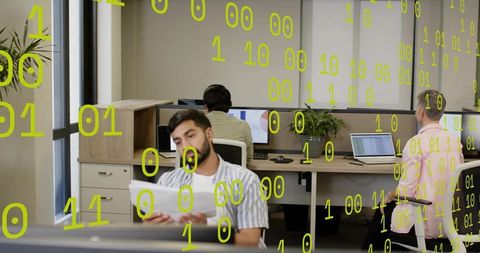 Reading bearded man holding printed papers in open office with binary code overlay