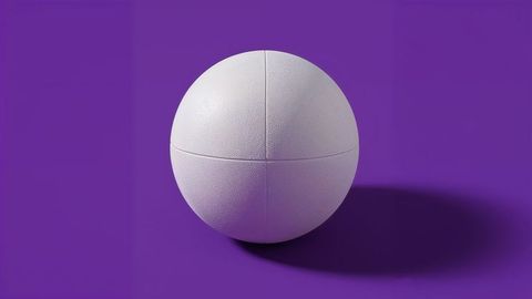Minimalist white dodge ball on purple surface