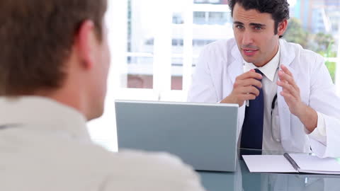 Doctor Consulting Patient in Modern Office Setting