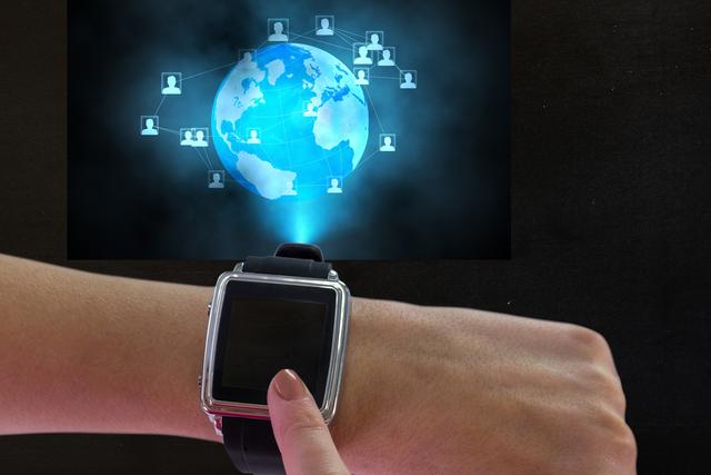 Digital composite of finger touching a smart watch