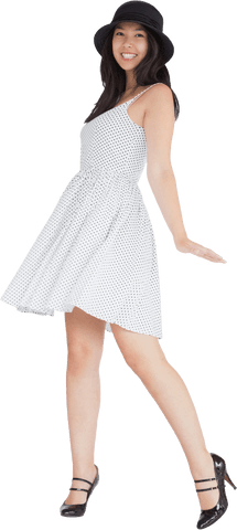 joyful woman twirling in stylish white polka dot dress with hat - Download Free Stock Videos Pikwizard.com
