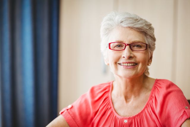 Senior woman smiling at camera in a retirement home