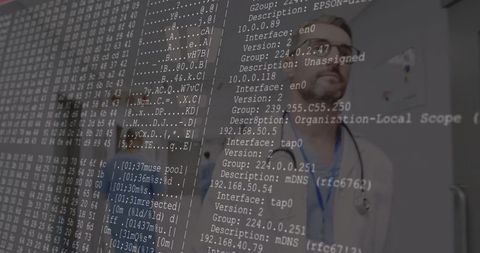 Doctor Analyzing Network Data on Transparent Display in Hospital Corridor