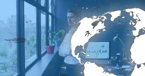 Executive studying global data visualization in modern office with world map overlay